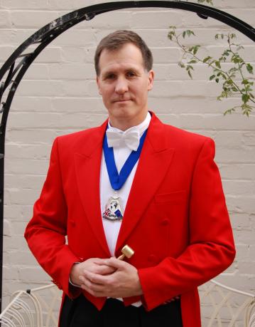 Find Toastmasters - The Man in the Red Coat