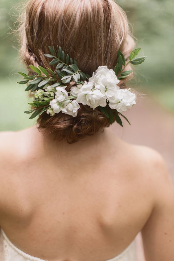 Over the years I’ve noticed a real decline in the addition of tiaras, headbands and even veils into wedding hairstyles.  These days brides want a much softer and less traditional look and believe a lot of hair accessories to be a bit too ‘fussy’. 
I must admit, my heart saddens a little when I hear at the trial that my bride isn’t really considering a hair piece. There are so many different options of hair accessories out there, including unconventional items such as the discarded ribbon or perhaps even an additional detail of lace that you have decided to discard from your dress.
So below I have listed a few of my favourite hair accessory options, why I love them so much and why they should definitely be something for you to consider.

Hair Vines
I think these have to be my current favourite of all the hair accessories out there.  Why?  Because not only are they very pretty, they are just so versatile! Vines are not just for long hair, they can be used for shorter styles too.  While they look absolutely beautiful entwined into half up and half down styles or even plaited into long hair, they can also look equally  beautiful nestled on top of a chignon or used as a half headband creeping up the side of your sweeping fringe.  Hair vines are are made of malleable wire which means they can be bent into any shape or even scrunched up so that they can really be worked into the hair to look seamless and truly part of the style.

Hair Combs
I still love a hair comb and while hair comb fascinators are still popular on mother’s of the bride or groom, I have definitely noticed less brides opting for one for themselves.  Hair combs come in all shapes and sizes.  They can be beautiful, large and jewel encrusted or small and delicate with just an arrangement of pearls or diamontes.
Once again with a hair comb, there are many options of where to wear them.  The most common place is off centre, nestled in a chignon or central at the back of a half up or half down style. They can also be nestled to the side, buried in the gathering of a side fringe.
There are some really beautiful hair combs out there which have a certain element of ‘vine’ to them which means the can be manoeuvred to work with the hair which can make the hair piece blend beautifully and be less obtrusive.

Fresh Flowers
Now this is an ever increasing popular choice and it’s a truly lovely idea.  Your florist should be able to make you some additional flowers to wear in your hair by re-enforcing the stems so that us hair stylists can pin them in securely.  You can opt for a large flower like an orchid or scatter rose buds or gypsophelia through your style - whatever takes your fancy!  Always discuss flower options with your florist as some will not particularly suitable to be worn in the hair and have a faster wilting rate!  There are lots of options to choose from and if you wanted something that was not suitable your florist should be able to find your a similar alternative as well as your hairstylist suggesting a good arrangement. I can assure you that you do not want limp, lifeless flowers in your hair, regardless of how pretty they were at the start so please do listen to their advice.

Scatter Pins
This has been another popular choice over recent years, however, I have noticed the use of scatter pins on the decline as well.  Scatter pins are another very versatile accessory.  They can be scattered through a messy up do or placed in an arrangement to form more of a hair piece.  You can get lovely simple pins with just a small diamonte or pearl on the end that you would hardly know was there until the caught in the light.  These are a lovely addition if you are not keen on the idea of hair pieces but need just a little something to break up your lovely volumous, deconstructed up do.  I would definitely consider this option if you have darker hair as blonde hair usually has highlights for the light to bounce of, it’s nice to define the styling of darker hair with a little something.  I would recommend 6-9 of the smaller ones for scattering.  Hair pins come in larger variety too with more detail on each pin and 3-6 of this variety would compliment your hairstyle nicely.


Parts of your dress
wedding trends, wedding hair trends, wedding looks, hair accessories, bridal hair, 2017 bride, 